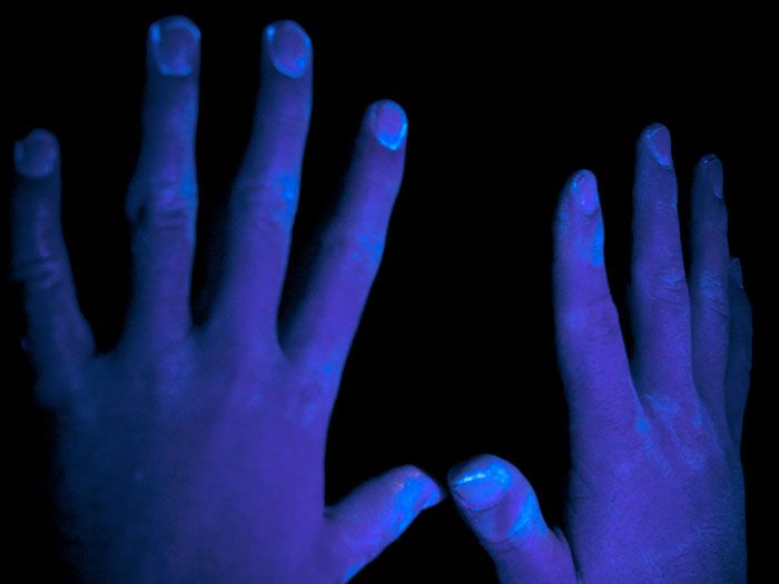 Step 4: Check hands under UV light to show areas not washed properly